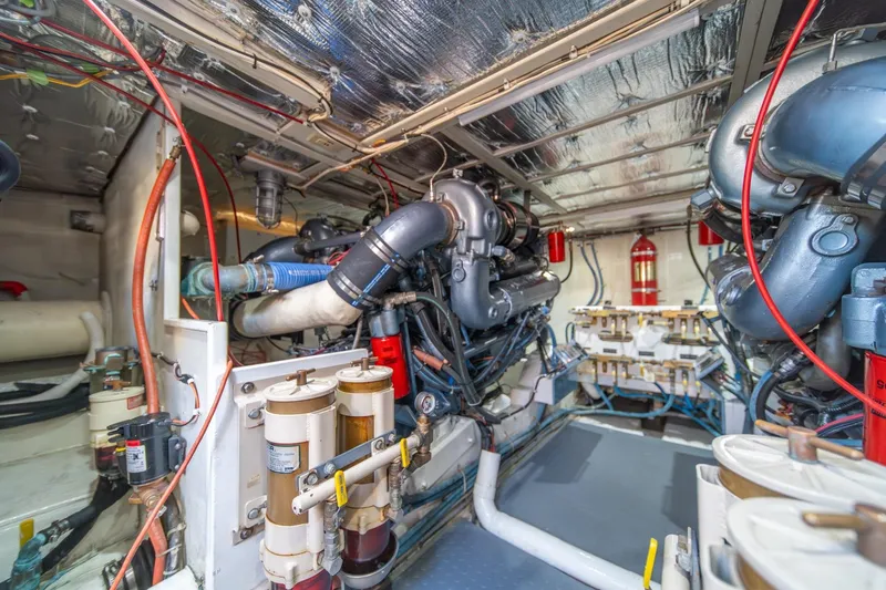 Slide: The Image of Engine room of 1991 Tollycraft 57 Pilothouse Motor Yacht, showcasing mechanical components. - 62