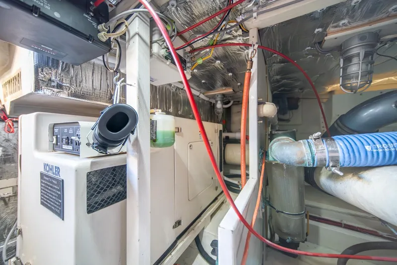 Slide: The Image of Engine room of 1991 Tollycraft 57 Pilothouse Motor Yacht with wiring and equipment. - 64