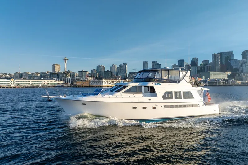 Slide: The Image of 1991 Tollycraft 57 Pilothouse Motor Yacht cruising near city skyline. - 7