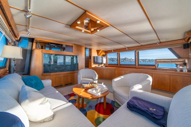 Slide: The Image of Luxurious interior of 1991 Tollycraft 57 Pilothouse Motor Yacht with panoramic windows. - 9