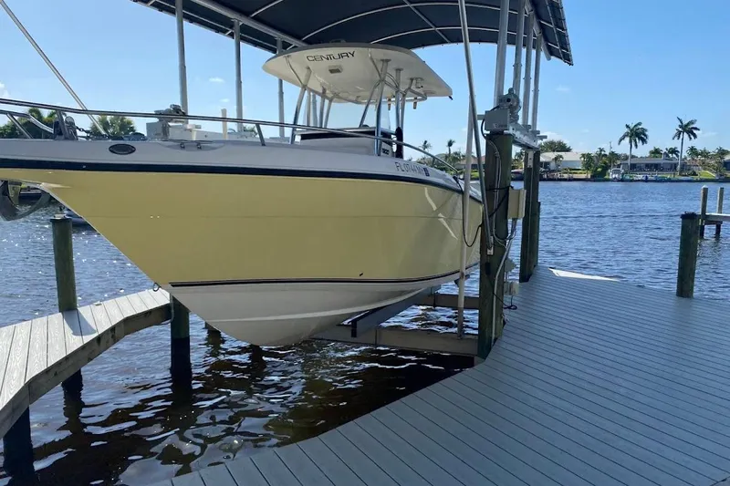 Slide: The Image of 2005 Century 2900 Center Console boat docked by waterfront. - 1