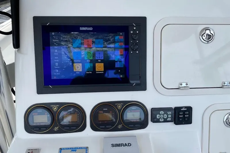Slide: The Image of Century 2900 Center Console 2005 dashboard with Simrad display and gauges. - 11
