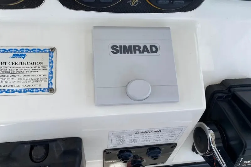 Slide: The Image of Control panel of a 2005 Century 2900 Center Console boat with Simrad equipment. - 13