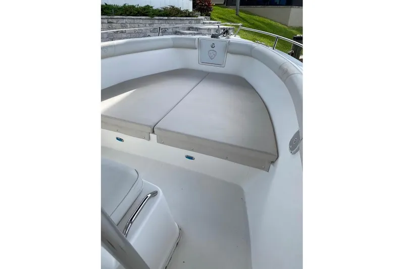 Slide: The Image of 2005 Century 2900 Center Console boat interior with cushioned seating area. - 18