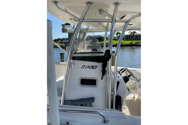 Slide: The Image of 2005 Century 2900 Center Console boat with sleek design, docked by the water. - 7