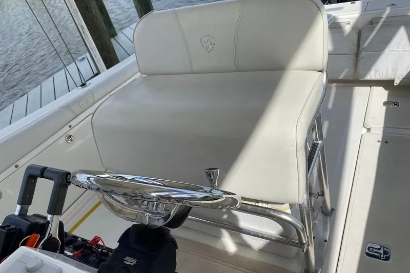 Slide: The Image of 2005 Century 2900 Center Console boat interior with steering wheel and seating. - 9