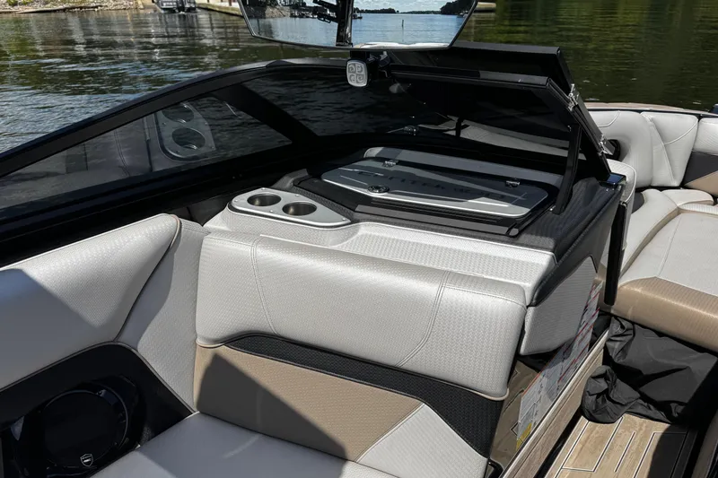 Slide: The Image of 2023 Centurion Ri265 boat interior with seating and storage compartment open. - 10