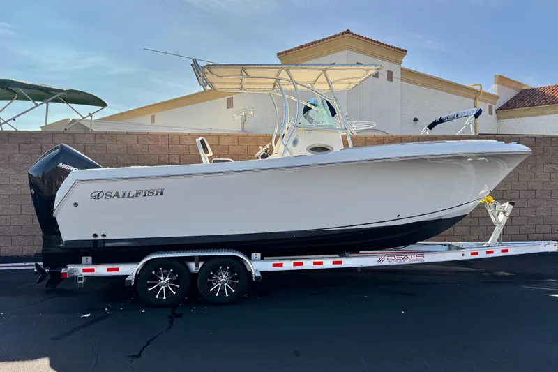 The Image of 2022 Sailfish 242 CC boat on trailer, parked outdoors, side view. - 0