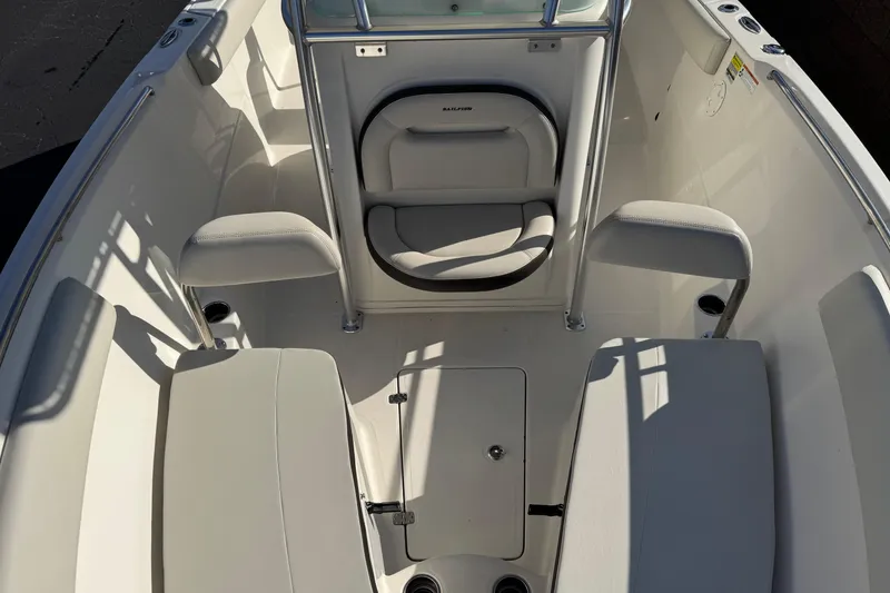 Slide: The Image of 2022 Sailfish 242 CC boat interior with seating and storage compartments. - 17