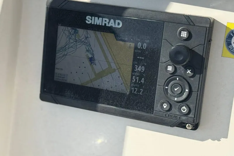 Slide: The Image of Simrad navigation display on 2022 Sailfish 242 CC boat dashboard. - 26