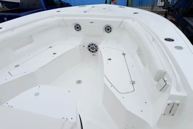 Slide: The Image of 2026 Tidewater 256 CC Adventure boat interior with spacious seating and modern design. - 17