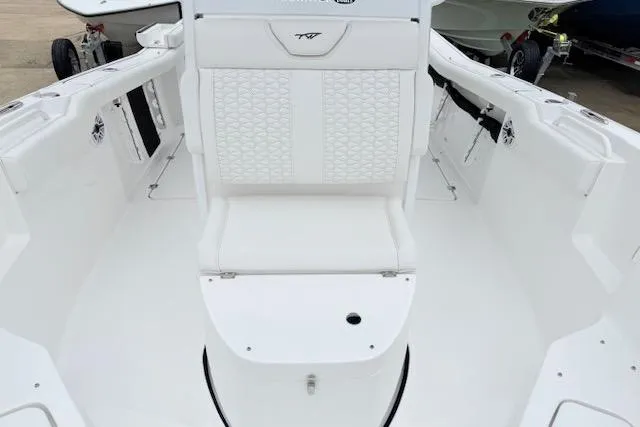 Slide: The Image of 2026 Tidewater 256 CC Adventure boat interior with white seating and modern design. - 18