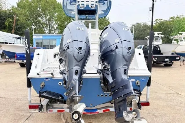 Slide: The Image of 2026 Tidewater 256 CC Adventure boat with dual Yamaha 150 engines, rear view. - 2