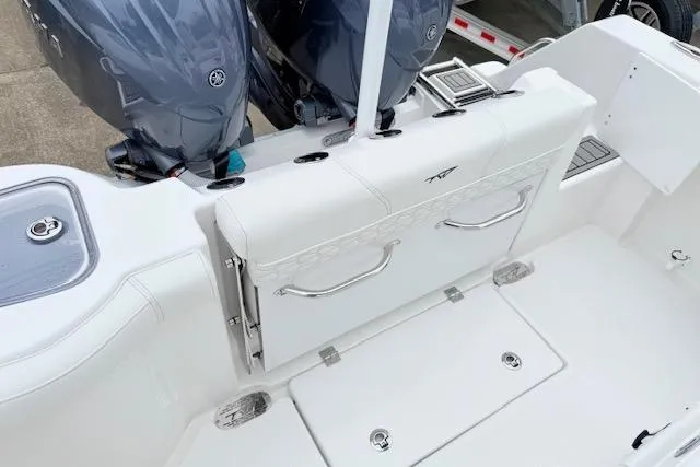 Slide: The Image of 2026 Tidewater 256 CC Adventure boat with dual engines and sleek white seating. - 3