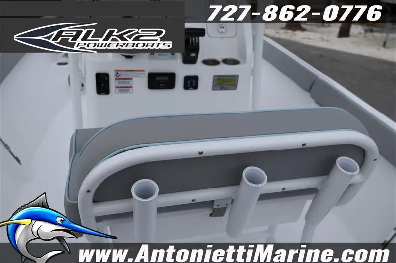 Slide: The Image of 2026 ALK2 Powerboats 23 CRX interior with rod holders and control panel. - 17