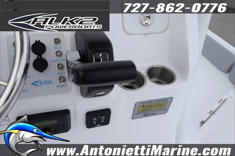 Slide: The Image of Control panel of 2026 ALK2 Powerboats 23 CRX with steering wheel and switches. - 19