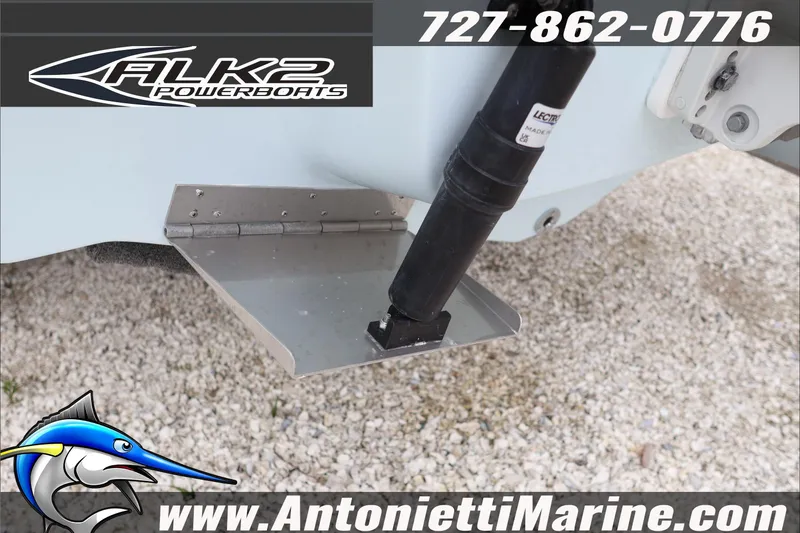 Slide: The Image of 2026 ALK2 Powerboats 23 CRX trim tab detail with contact information and logo. - 8