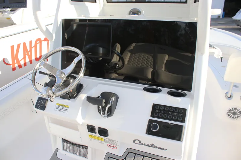 Slide: The Image of 2026 Tidewater 2500 Carolina Bay boat with luxurious white seating and modern design. - 10