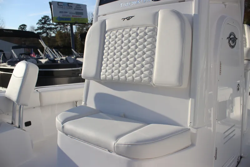 Slide: The Image of 2026 Tidewater 2500 Carolina Bay boat with open storage compartment on deck. - 12