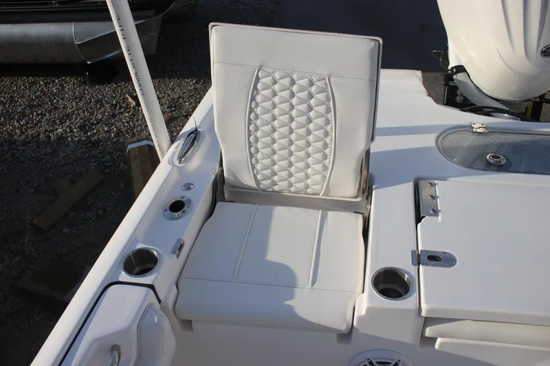 Slide: The Image of 2026 Tidewater 2500 Carolina Bay boat console with steering wheel and controls. - 15