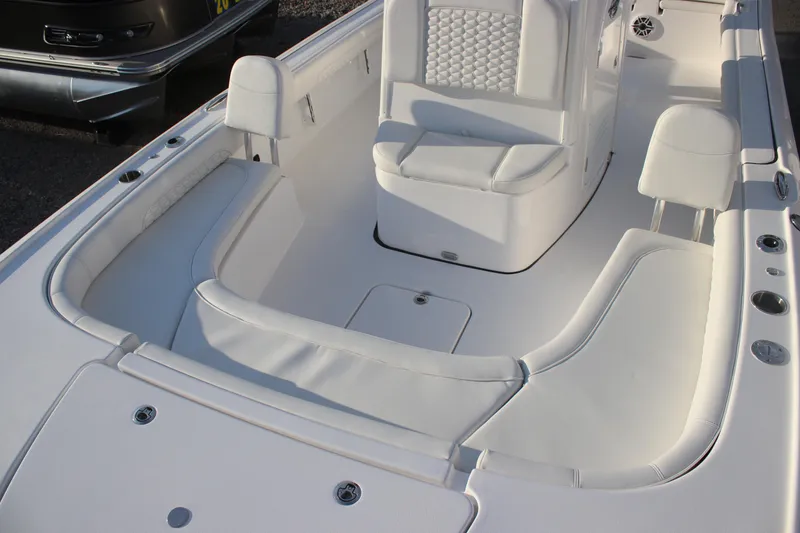 Slide: The Image of 2026 Tidewater 2500 Carolina Bay boat interior with cushioned seating and sleek design. - 17
