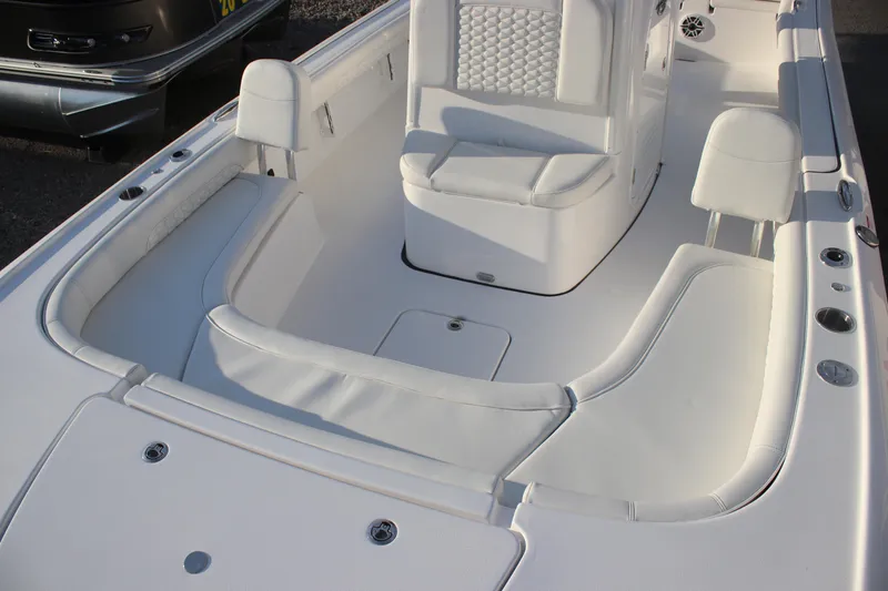 Slide: The Image of 2026 Tidewater 2500 Carolina Bay boat seat with quilted design and cup holders. - 18