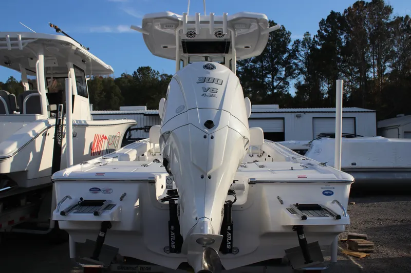 Slide: The Image of 2026 Tidewater 2500 Carolina Bay boat interior with white seating and modern design. - 23