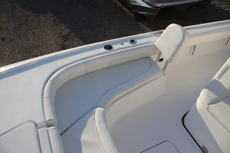 Slide: The Image of 2026 Tidewater 2500 Carolina Bay boat interior with white cushioned seating. - 26