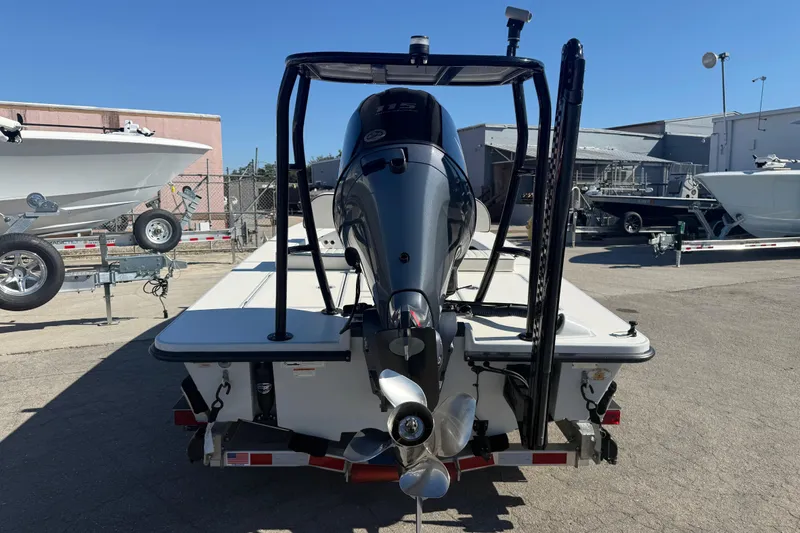 Slide: The Image of 2020 Maverick 18 HPX-V boat with outboard motor, parked on a trailer in a lot. - 10