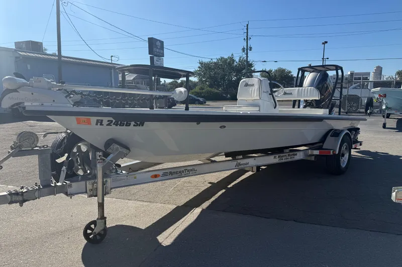Slide: The Image of 2020 Maverick 18 HPX-V boat on trailer in sunny outdoor setting. - 13