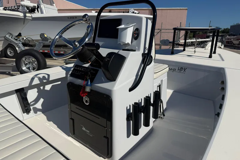 Slide: The Image of 2020 Maverick 18 HPX-V boat console with steering wheel and controls. - 6