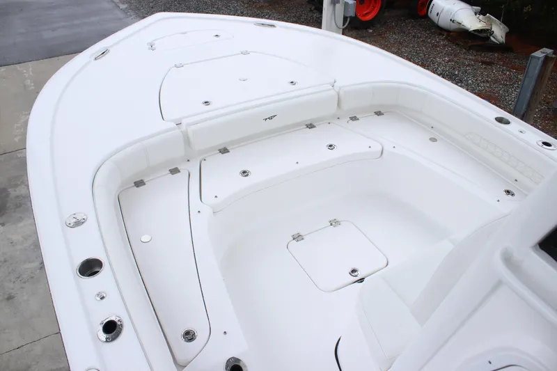 Slide: The Image of 2026 Tidewater 2500 Carolina Bay boat interior with spacious seating and storage compartments. - 4