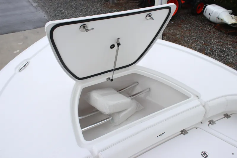Slide: The Image of 2026 Tidewater 2500 Carolina Bay boat with open storage compartment on deck. - 6
