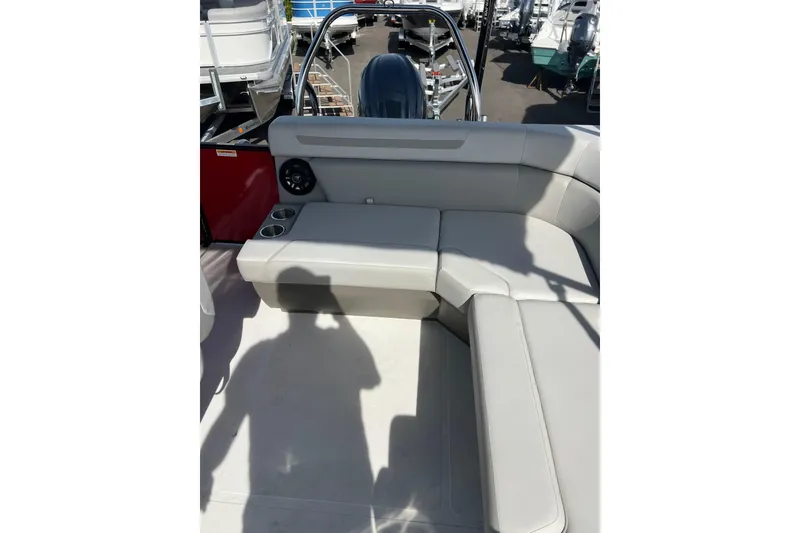 Slide: The Image of 2026 Hurricane FunDeck 2260 REF OB boat interior with cushioned seating and cup holders. - 13