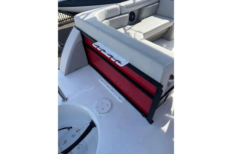 Slide: The Image of 2026 Hurricane FunDeck 2260 REF OB boat interior with seating and storage compartment. - 18