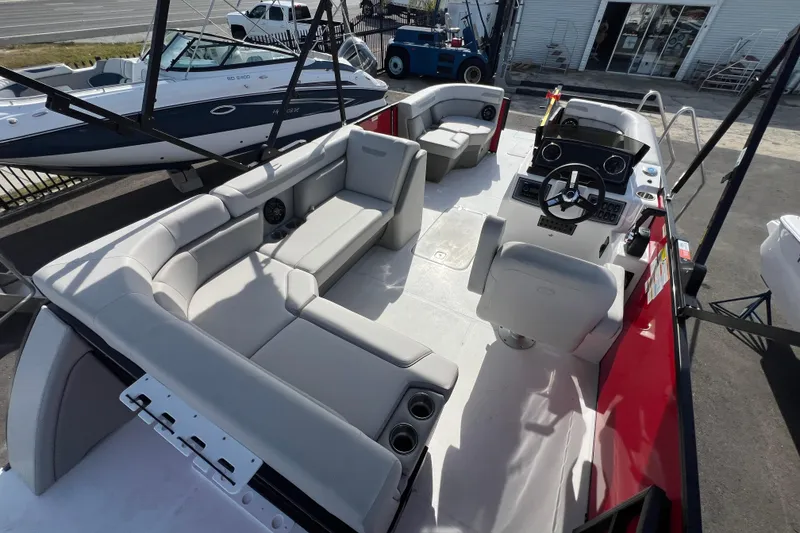Slide: The Image of 2026 Hurricane FunDeck 2260 REF OB boat with spacious seating and modern helm. - 20