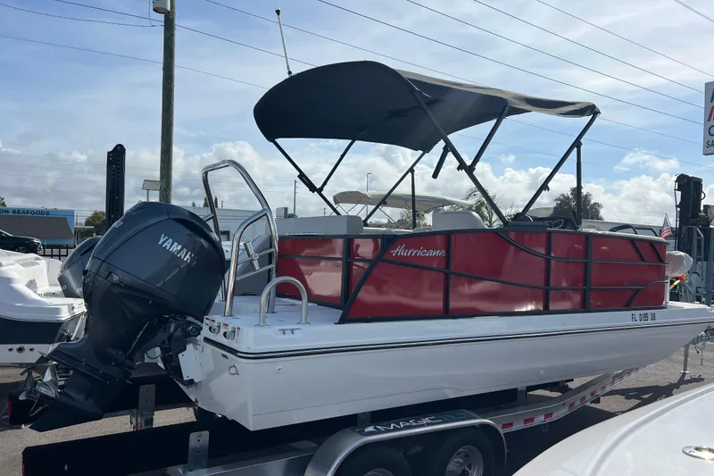 Slide: The Image of 2026 Hurricane FunDeck 2260 REF OB boat with Yamaha outboard motor on trailer. - 5