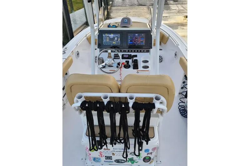 Slide: The Image of 2019 Sportsman Heritage 241 Center Console dashboard with navigation and control screens. - 15