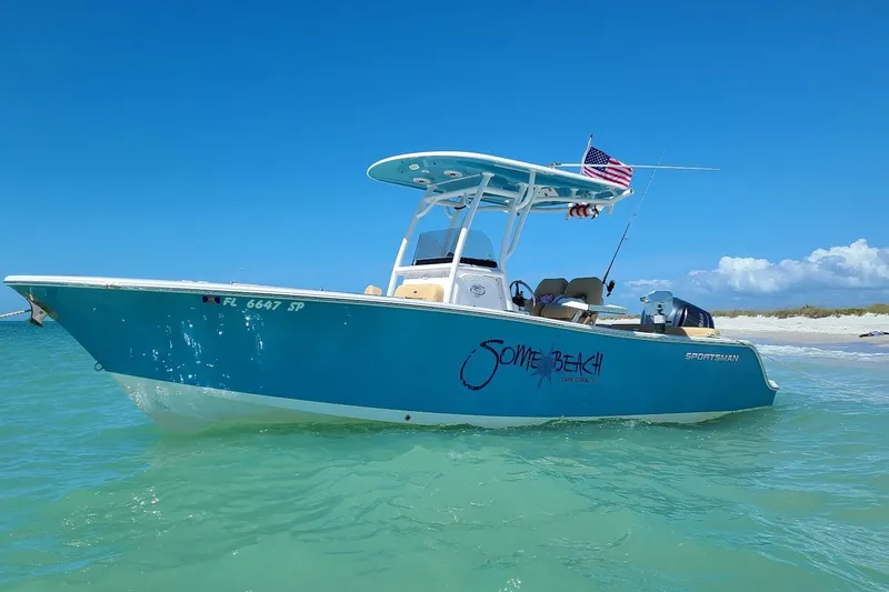 Slide: The Image of 2019 Sportsman Heritage 241 Center Console boat docked in a scenic marina. - 3