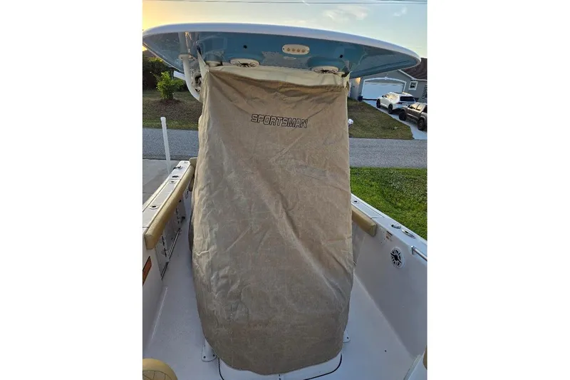 Slide: The Image of 2019 Sportsman Heritage 241 Center Console with protective cover in a residential driveway. - 30