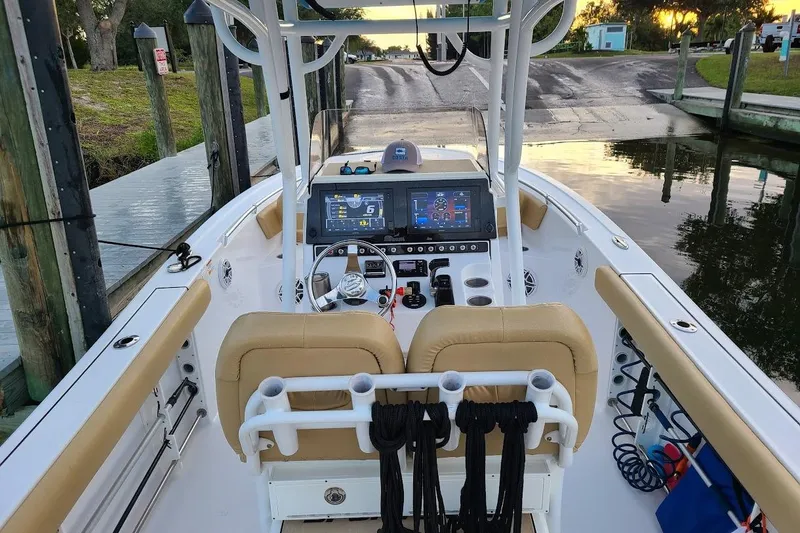 Slide: The Image of 2019 Sportsman Heritage 241 Center Console boat with tan seating and sleek design. - 9
