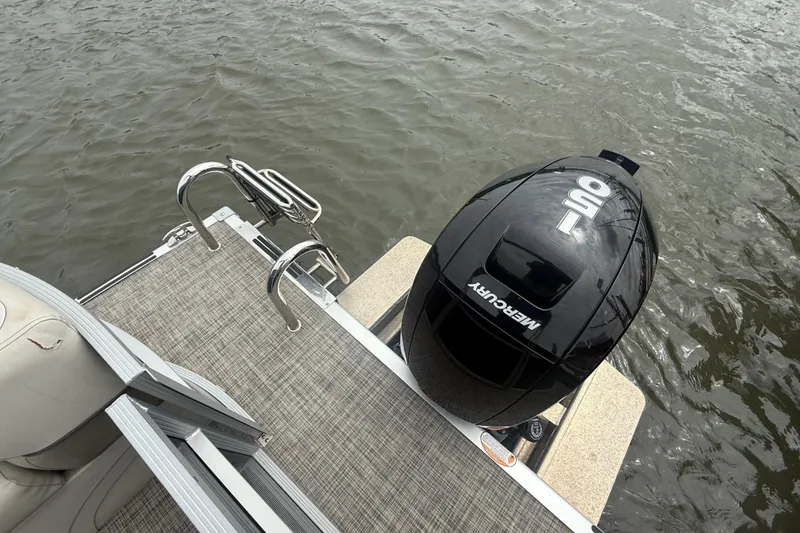 Slide: The Image of 2023 Cypress Cay Seabreeze 232 boat with Mercury outboard motor on water. - 11