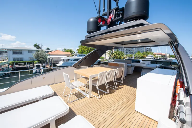 Slide: The Image of Luxurious 2022 Sanlorenzo SL78 yacht deck with dining area and modern seating. - 11