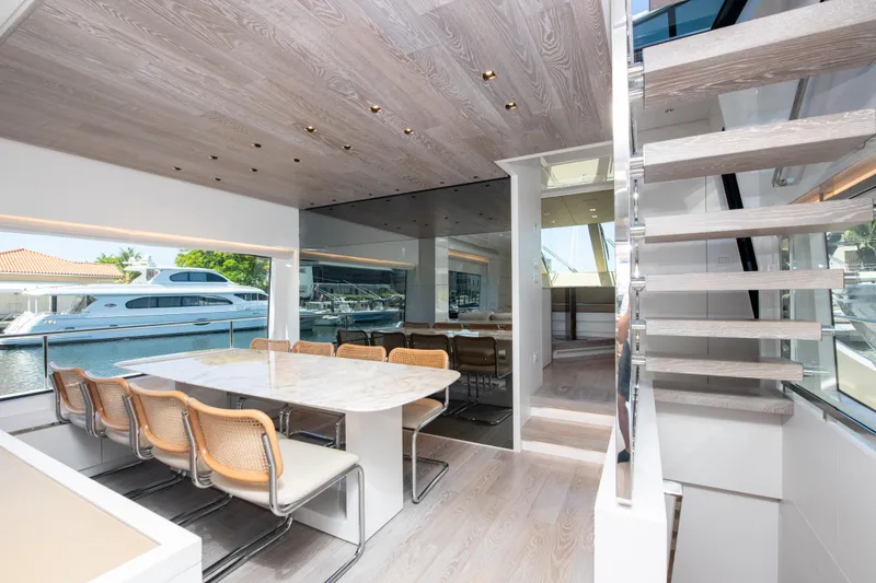 Slide: The Image of Luxurious interior of 2022 Sanlorenzo SL78 yacht with modern dining area and staircase. - 16