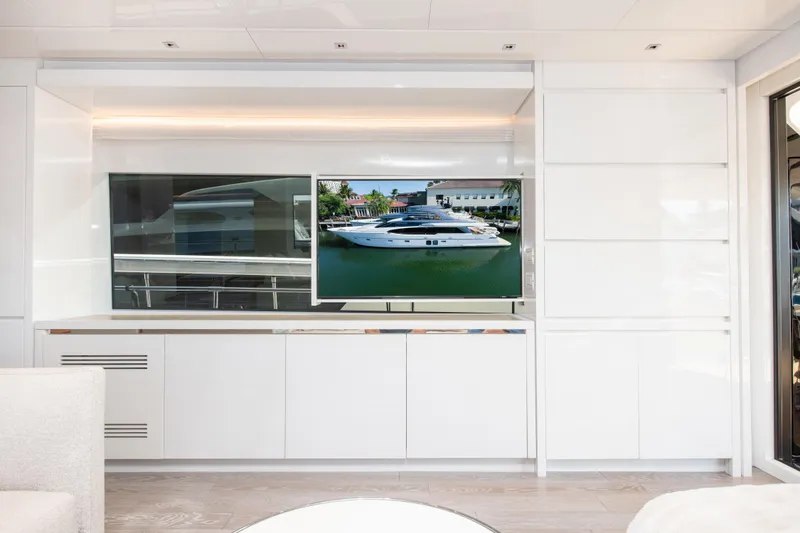 Slide: The Image of Luxurious interior of 2022 Sanlorenzo SL78 yacht with sleek white cabinetry and modern TV display. - 17