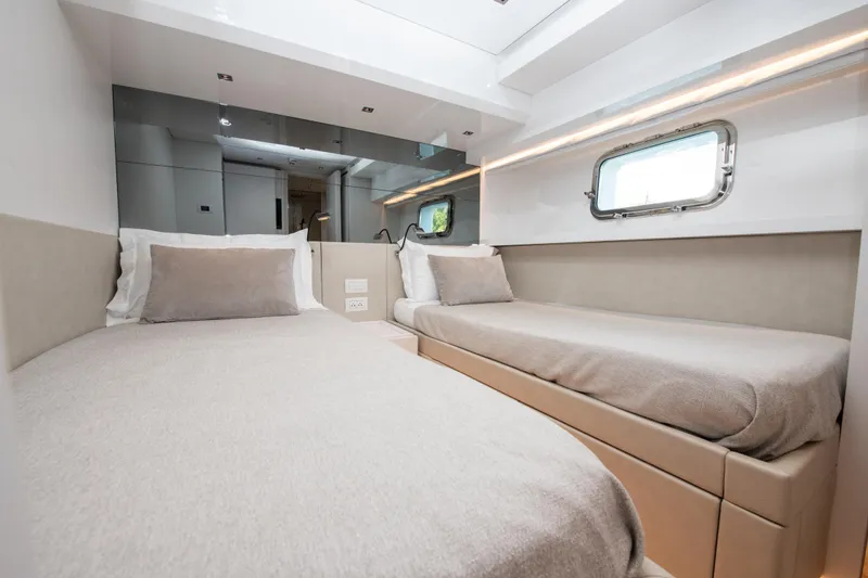 Slide: The Image of Luxurious twin cabin interior on 2022 Sanlorenzo SL78 yacht, featuring modern design and comfortable bedding. - 27