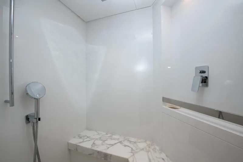 Slide: The Image of Luxurious shower area in 2022 Sanlorenzo SL78 yacht with marble bench and modern fixtures. - 32