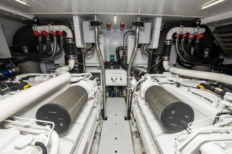 Slide: The Image of Engine room of 2022 Sanlorenzo SL78 yacht, featuring dual engines and advanced piping system. - 34