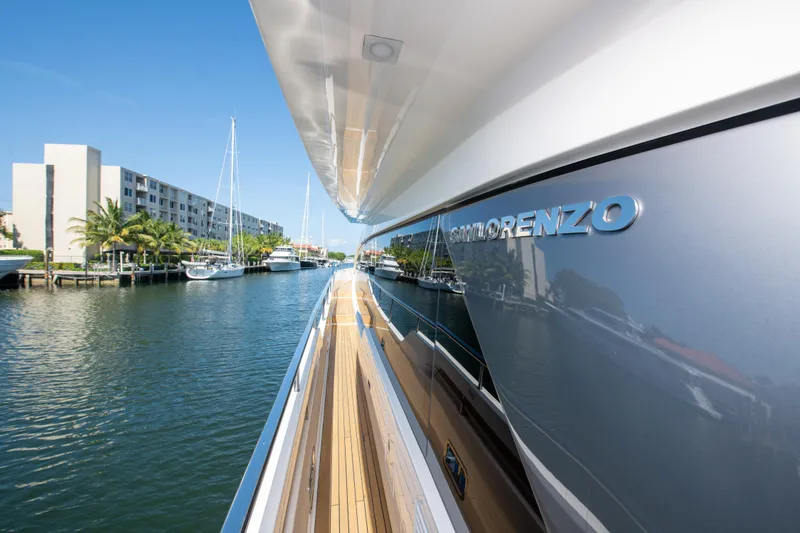 Slide: The Image of Sanlorenzo SL78 yacht, 2022 model, docked in a marina with clear blue skies. - 36
