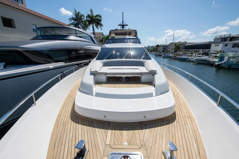 Slide: The Image of Sanlorenzo SL78 2022 yacht with sleek design and spacious deck, docked in a marina. - 4
